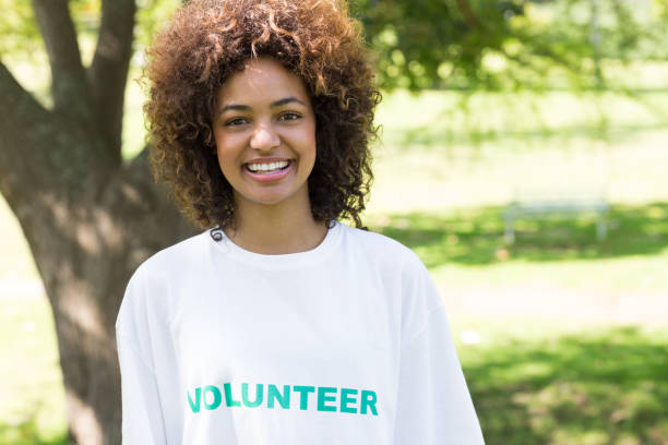 istock Confident female volunteer in park 690404436