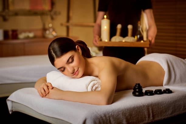 istock Beautiful woman lying in spa massage salon 690406824