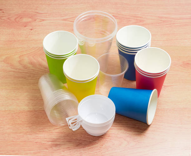 istock Different disposable plastic cups and paper cups in different colors 690408790
