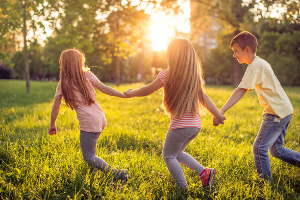 istock Happy children running in park 690408838