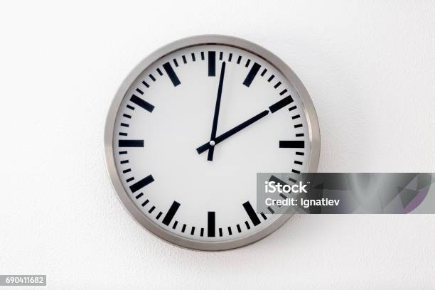 Round Metal Clock On White Wall Stock Photo - Download Image Now - Clock, Cut Out, School Building