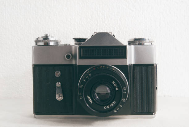 istock Old Soviet film camera with lens on white background close-up 690411808