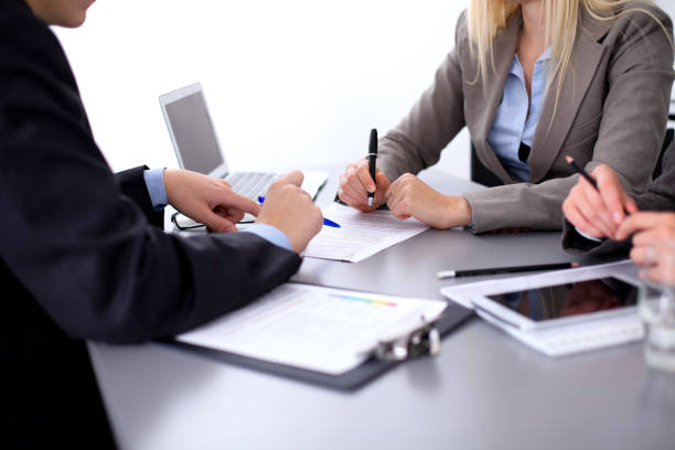 istock Group of business people working together in office 690415172