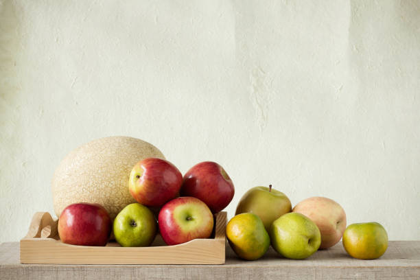 istock Many fruits on wooden tray. 690415508