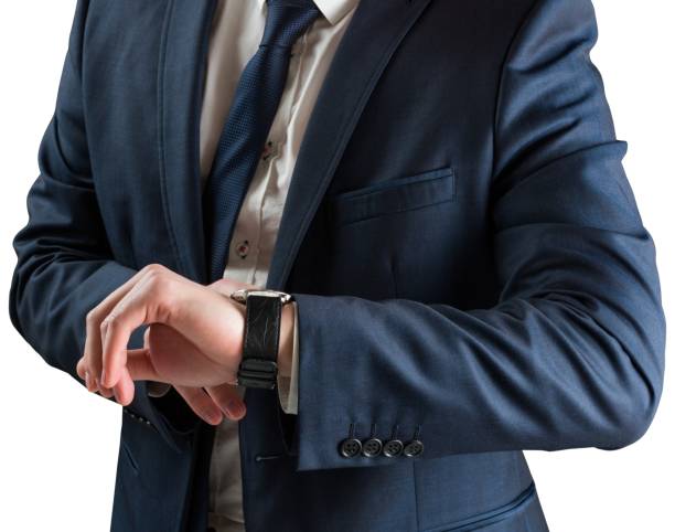 istock Businessman checking the time on watch 690416340