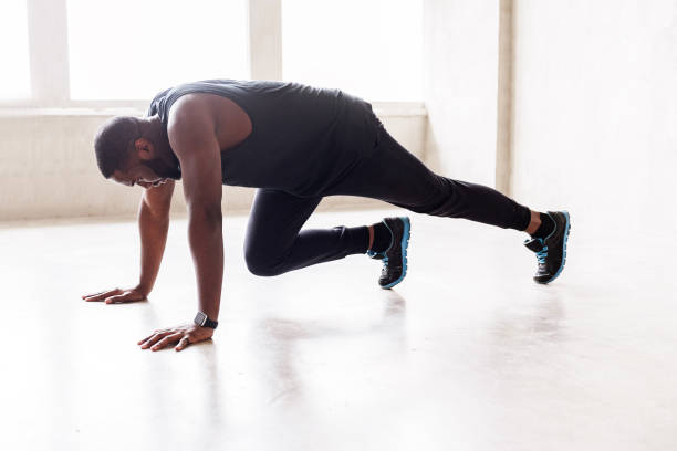 istock Solemn handsome sporty guy training his body 690419316