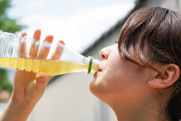 istock Young woman staying hydrated during sport 690422822
