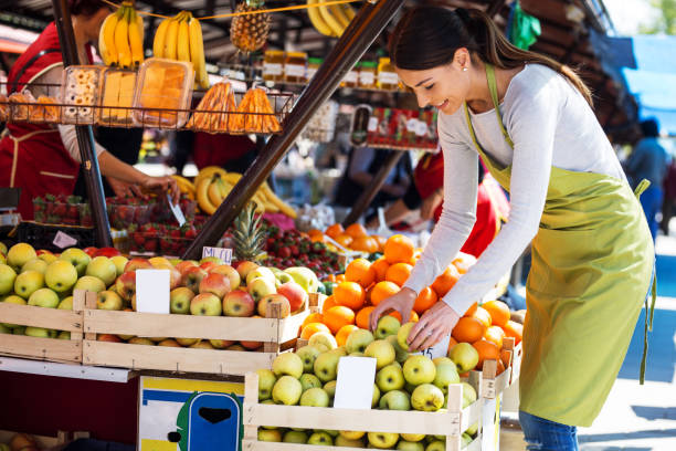 istock Young attractive fruit market saleswoman 690423048