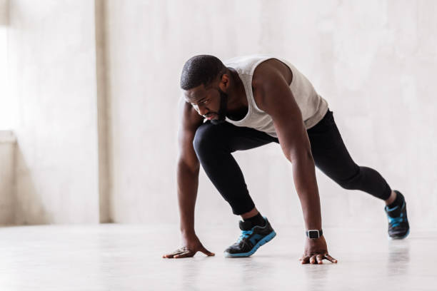 istock Angry bearded african sportsman going to start jogging exercise 690423332