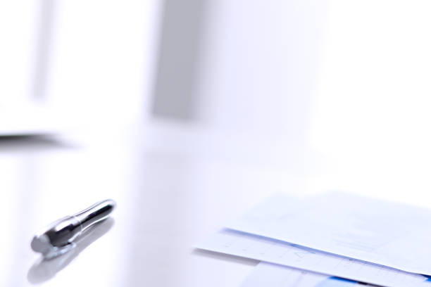 istock Office workplace with a laptop and financial documents 690427898