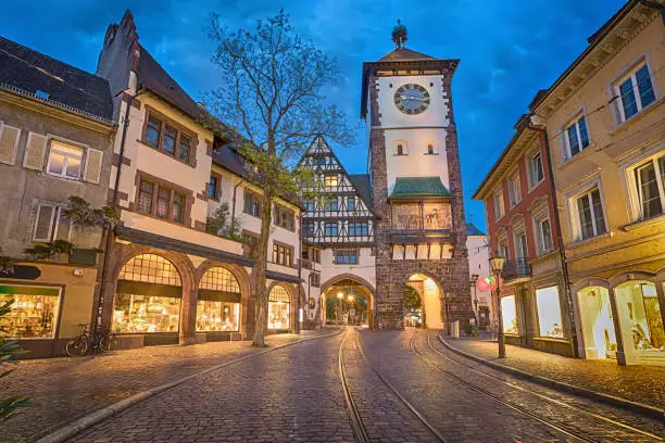 Schwabentor - historical city gate at dusk in Freiburg im Breisgau, Baden-Wurttemberg, Germany