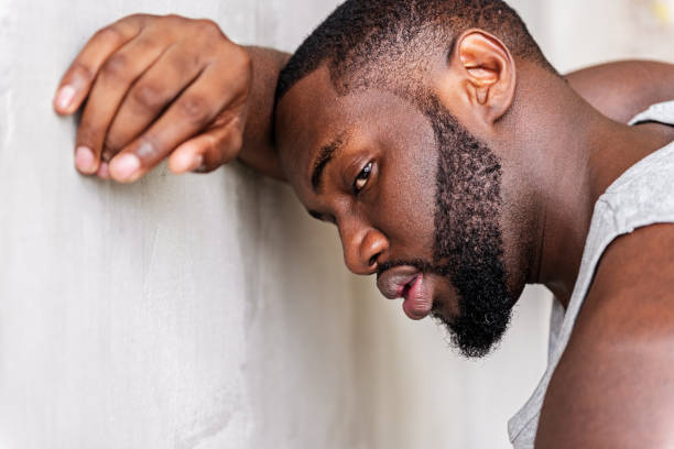 istock Tired young african sportsman having recreation time 690428896