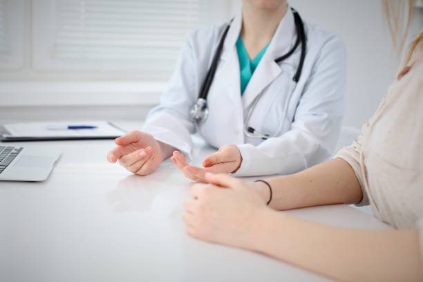 istock Doctor and patient are discussing something, just hands at the table 690432450