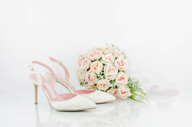 istock Wedding Bridal Shoes With Pink Roses 690437248