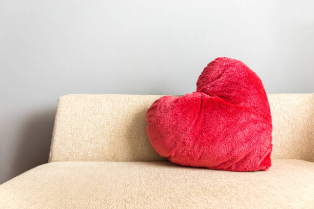 pillow red heart or love shape on sofa stock photo