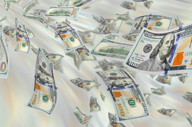 istock Cash flow - hundred dollar bills in the air. 690440954