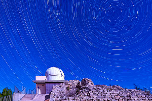 istock Star trails and astronomy observatory 690444574