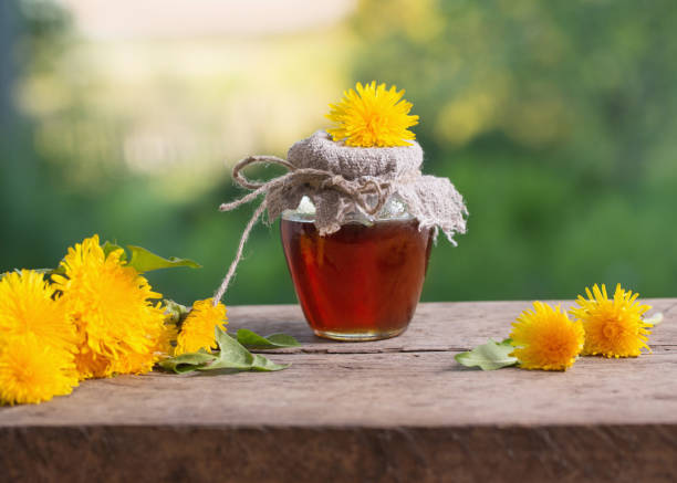 istock Jam from dandelions on a wooden table 690451160