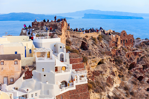 Byzantine Castle Ruins in Oia Santorini island in the Cyclades, Greece on sunset