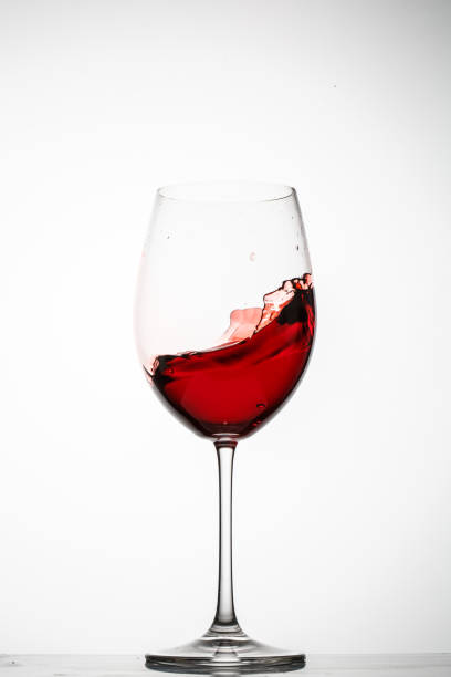 istock Red wine splashes in a glass 690469886