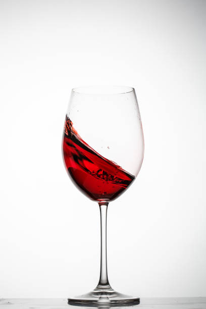 istock Red wine splashes in a glass 690469888