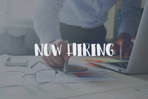 istock Now hiring message on the working in the office on table background. 690470196