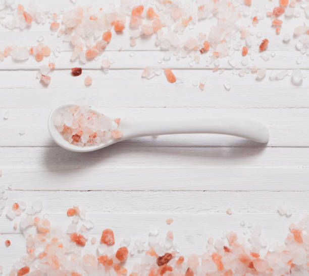 istock himalayan salt on white wooden background 690474236