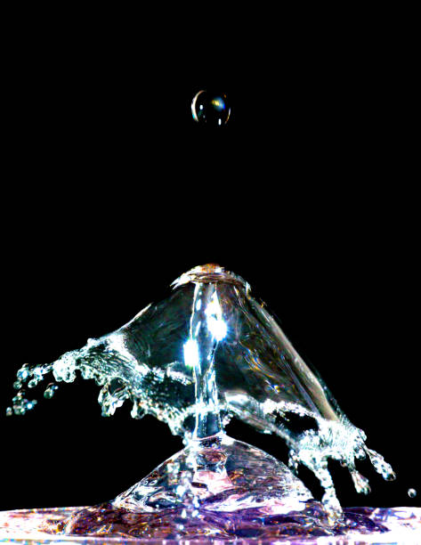 istock Colorful liquid splash isolated on black background 690481970