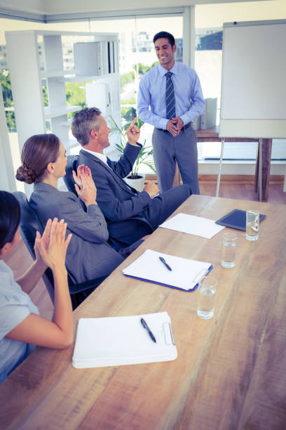 istock Business people applauding during a meeting 690482102