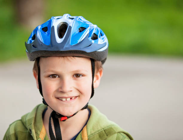 istock Happy Boy Wearing a Helmet 690482750