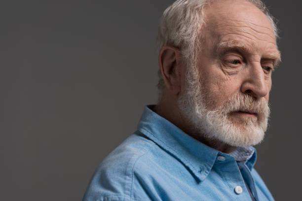 istock portrait of senior bearded man isolated on grey in studio 690482846