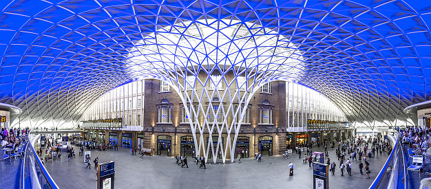 People moving through Kings Cross Train Station, London, England, UK.