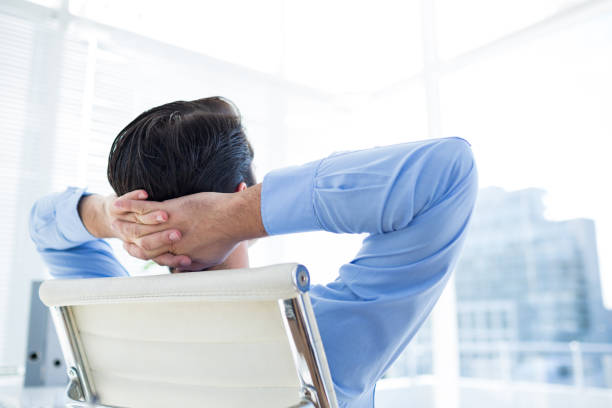 istock Thoughtful businessman at office desk 690486640