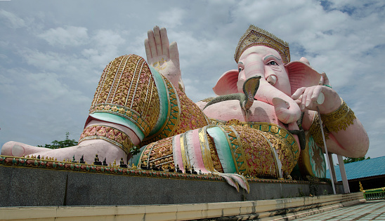 Ganesh statue pink color thai called Phra Pikanet at outdoor for people visit and respect praying at Lord Ganesha Park on May 9, 2017 in Nakhon Nayok, Thailand