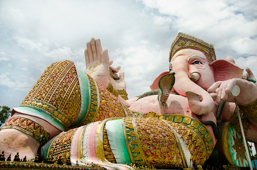 Ganesh statue pink color thai called Phra Pikanet at outdoor for people visit and respect praying at Lord Ganesha Park on May 9, 2017 in Nakhon Nayok, Thailand