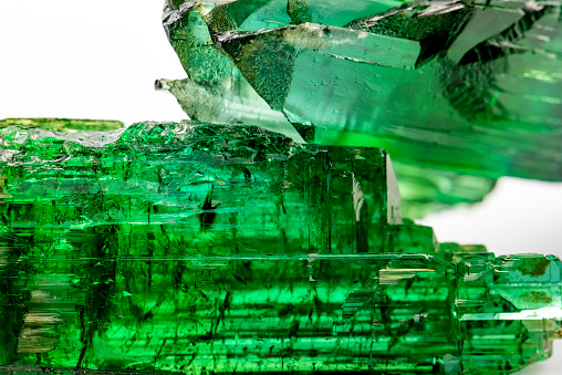 Detail of brazilian green tourmaline crystal with its texture, colors and transparency