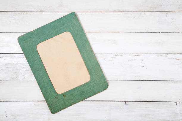 istock Retro photo frame on wooden background 690490154