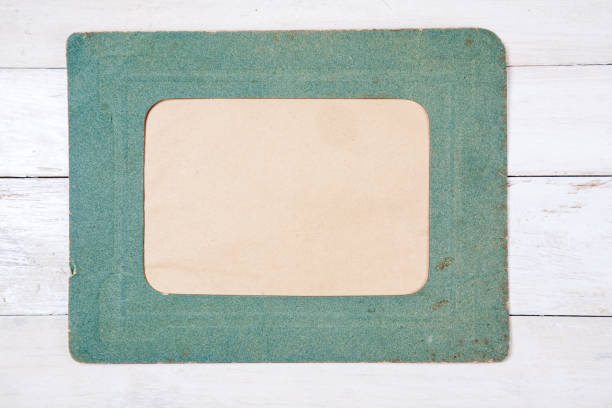 istock Retro photo frame on wooden background 690490242