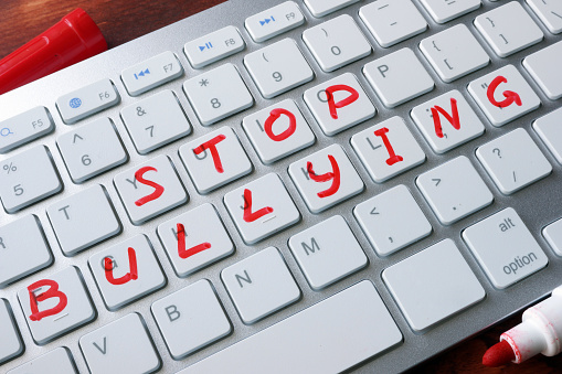 Words stop bullying written on a keyboard.