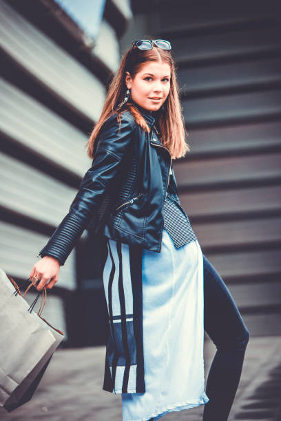 istock She is dancing with shopping bags 690493498