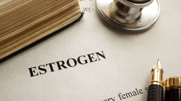 istock Page with title estrogen and book. Human hormones. 690496066