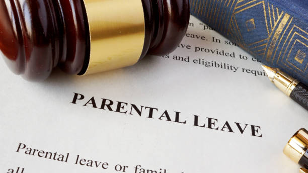 istock Page with title Parental leave and gavel. 690496558