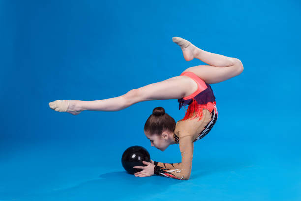 istock Young caucasian gymnast with a ball 690500420