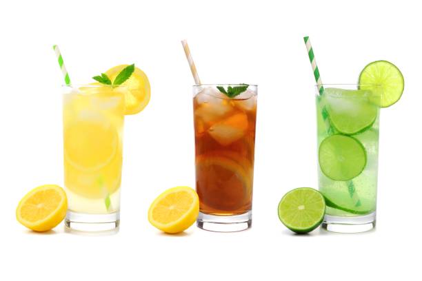istock Three glasses of summer lemonade, iced tea, and limeade drinks isolated on white 690511674