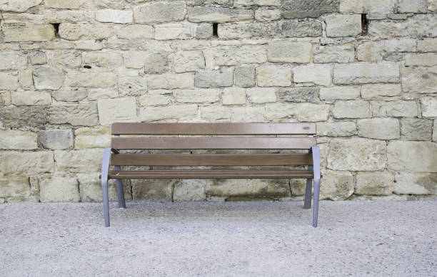 istock Wooden bench in street 690518304