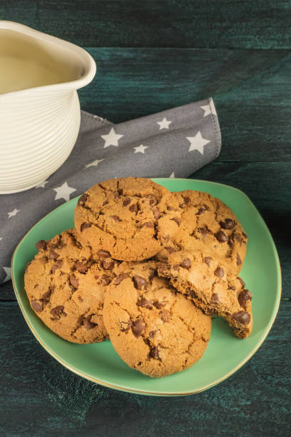 istock Chocolate chips cookies with jar of milk and copyspace 690518760