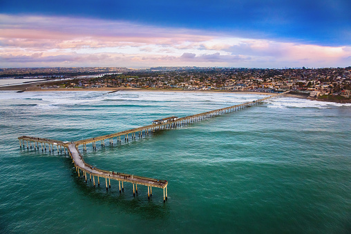 Aerial view of the Ocean Beach Pier in the community of Ocean Beach, known by the locals as O.B., in the city of San Diego, California.