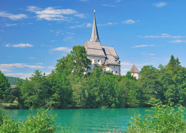 Maria Woerth Church,Lake Woerthersee,Austria Maria Woerth Church at Lake Woerthersee near Klagenfurt in Carinthia,Austria maria woerth stock pictures, royalty-free photos & images