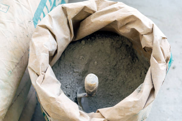trowel and cement powder stock photo