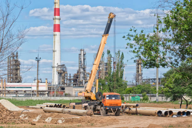 istock Welding on large diameter pipeline with  use of crane 690532390